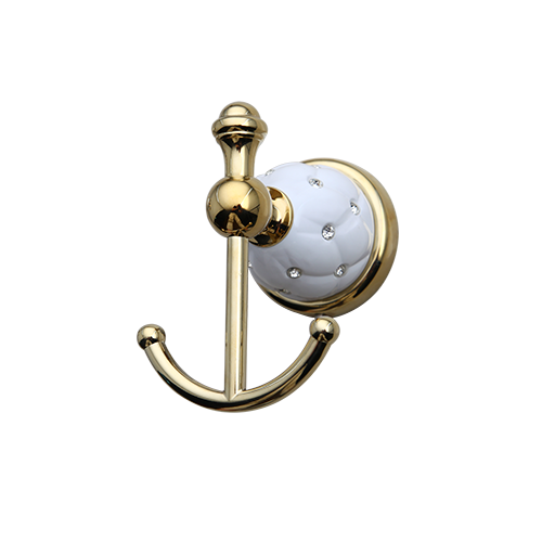Gold-colored towel hook with white elements