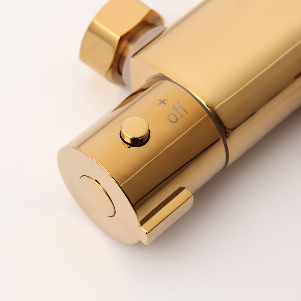 Gold-colored thermostatic bath tap