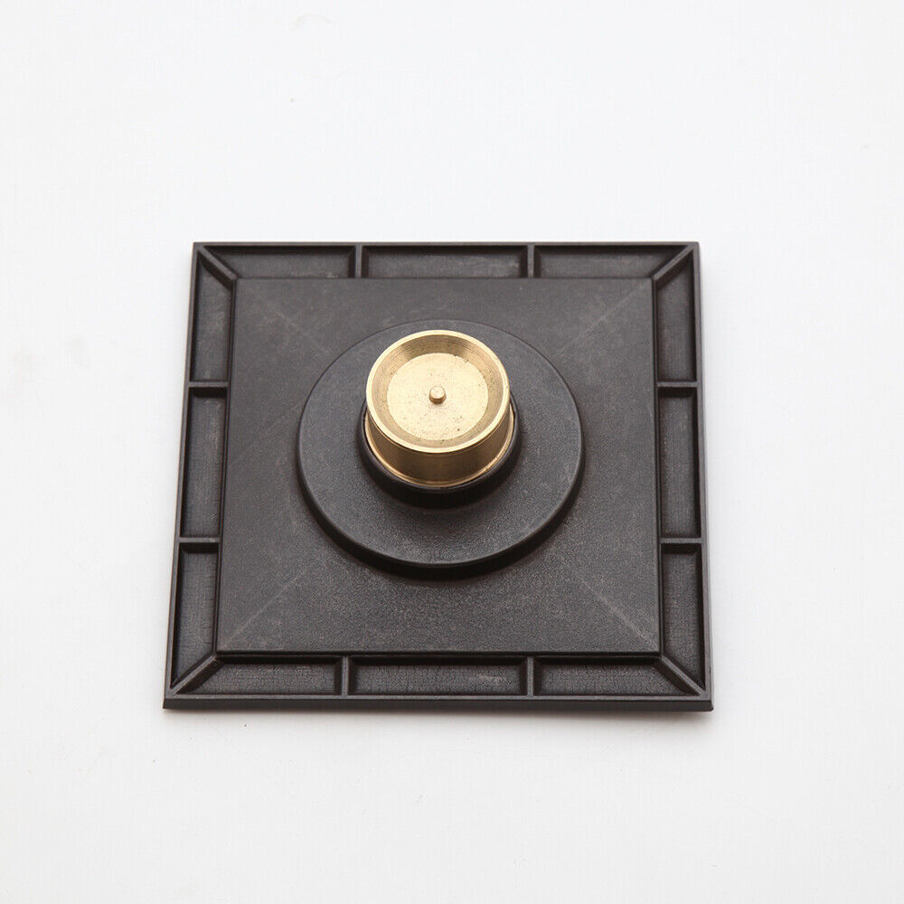 Bronze-colored shower drain with flower motif