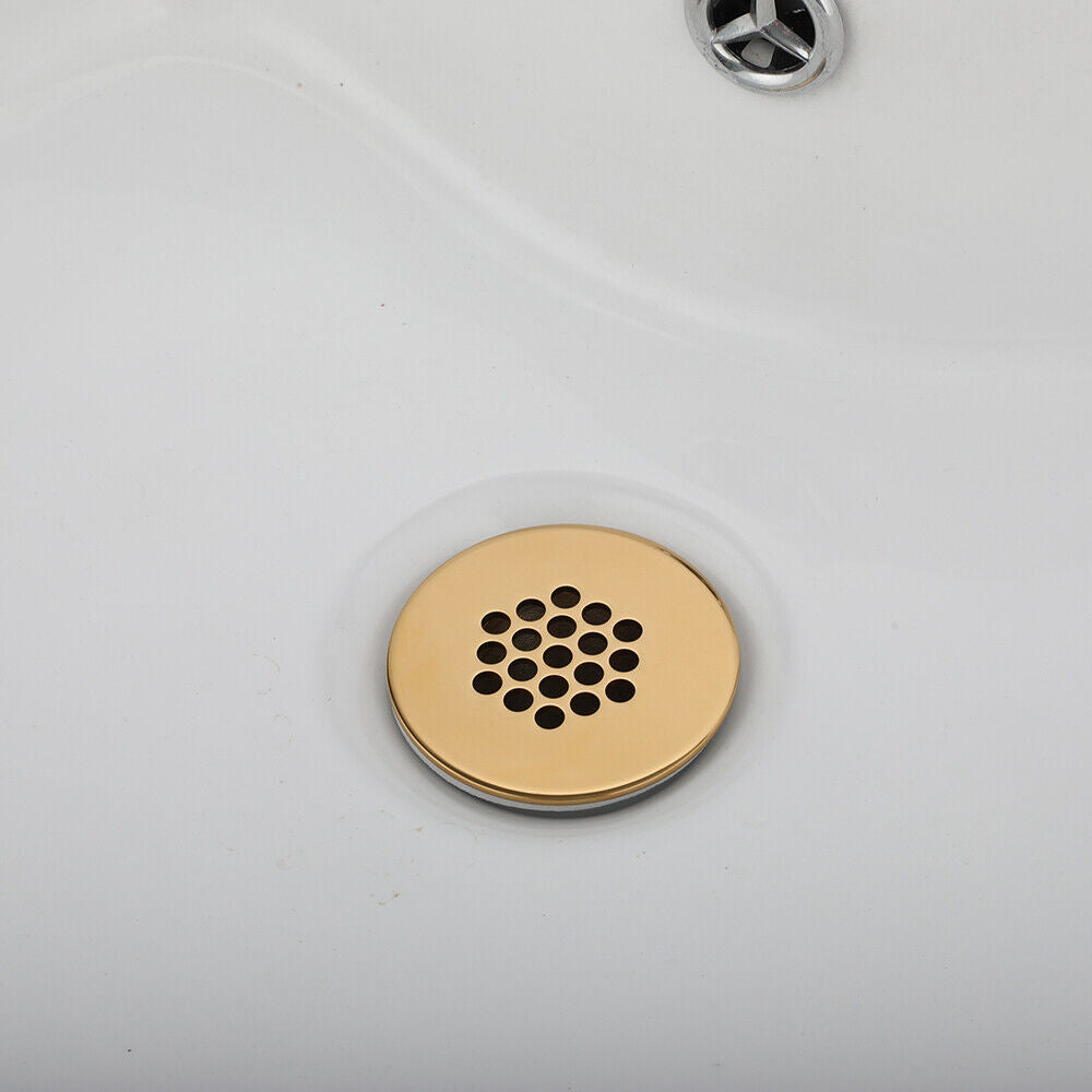 Gold-colored washbasin drain not closable