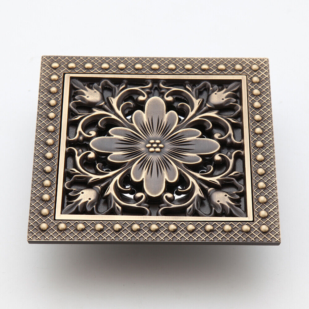 Bronze-colored shower drain with flower motif
