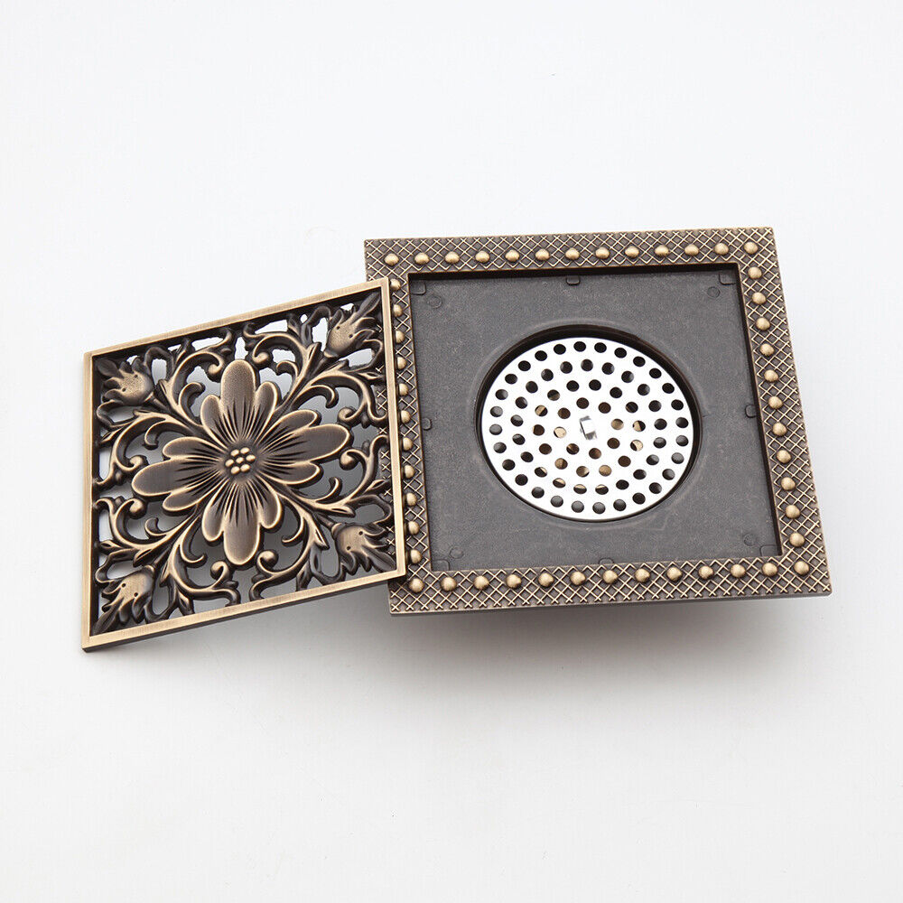 Bronze-colored shower drain with flower motif