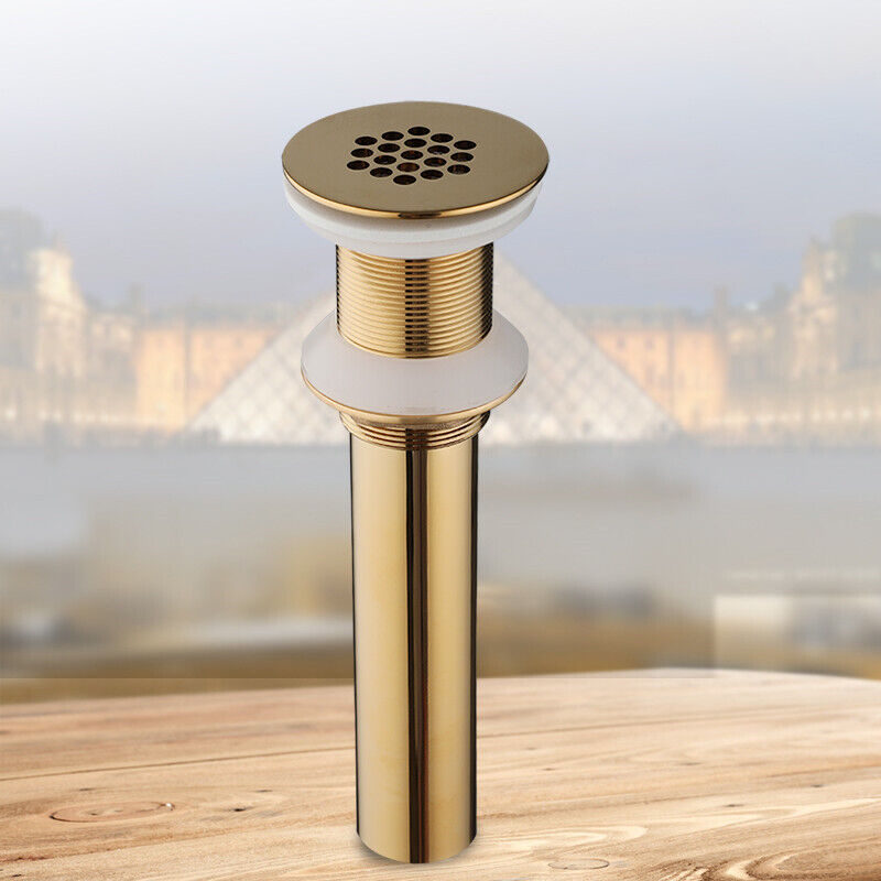 Gold-colored washbasin drain not closable