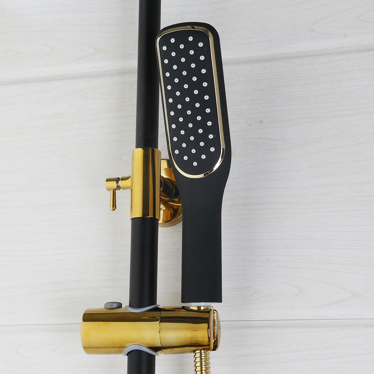 Matt black and gold surface-mounted shower