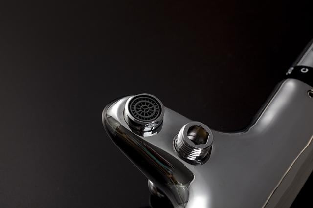 Thermostatic bath tap with hand shower connection.