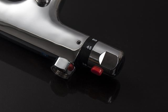 Thermostatic bath tap with hand shower connection.