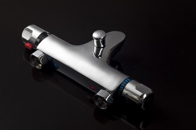 Thermostatic bath tap with hand shower connection.