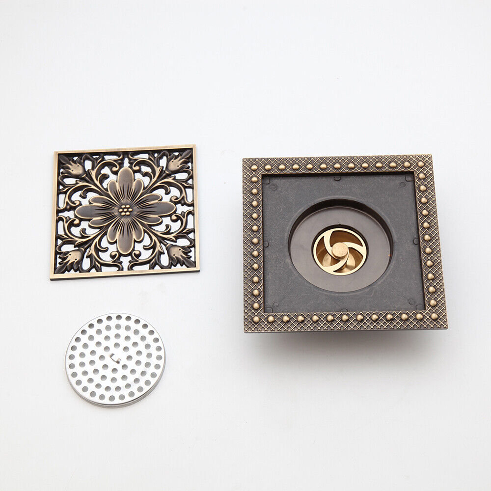 Bronze-colored shower drain with flower motif