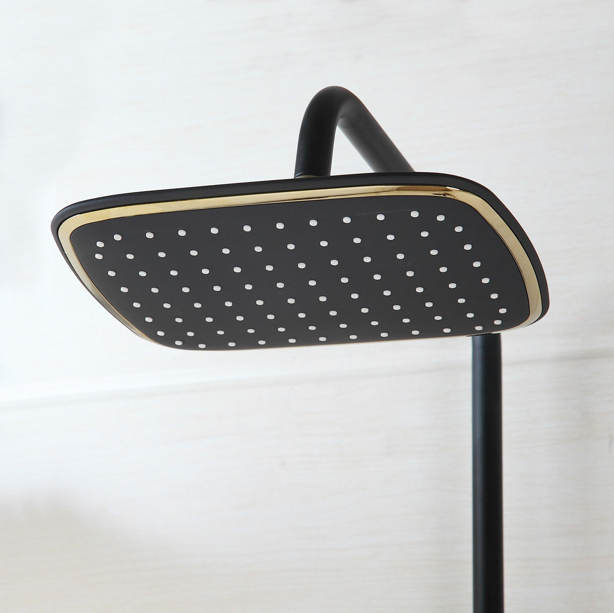 Matt black and gold surface-mounted shower