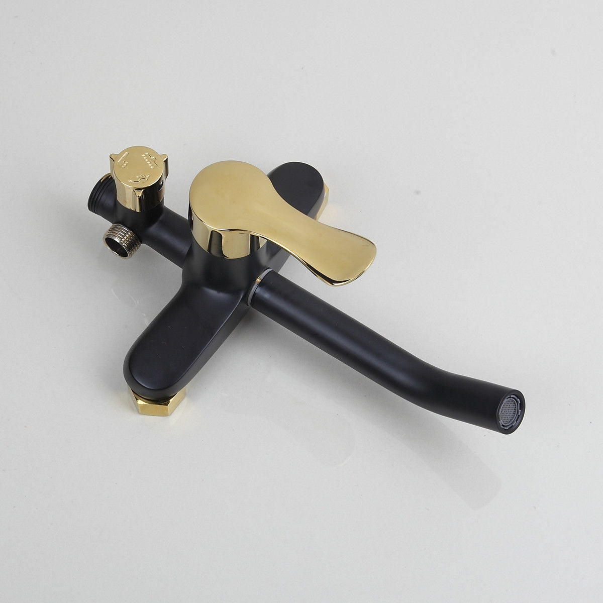 Matt black and gold surface-mounted shower