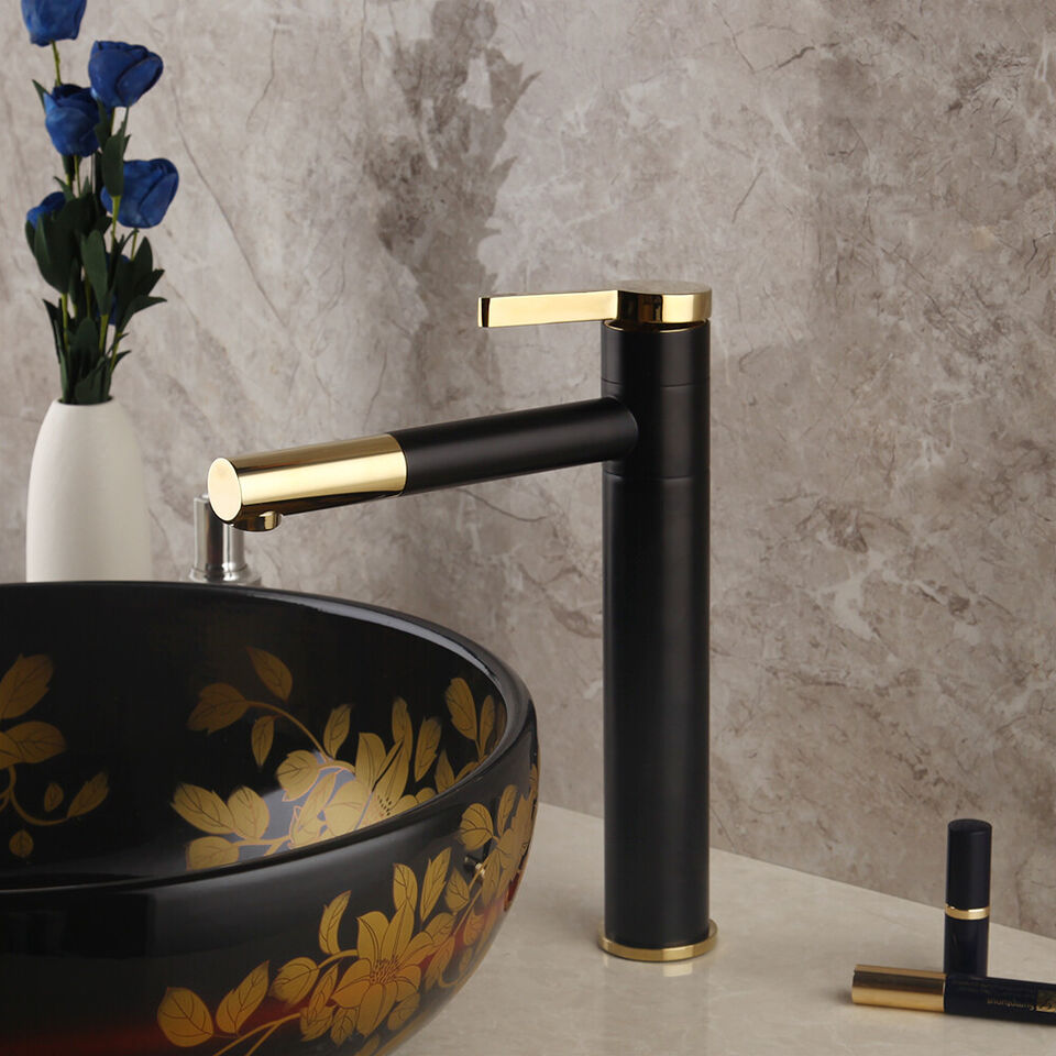 Black washbasin mixer tap with gold-colored elements