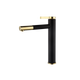 Black washbasin mixer tap with gold-colored elements
