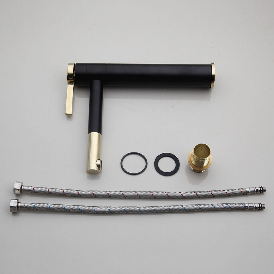 Black washbasin mixer tap with gold-colored elements