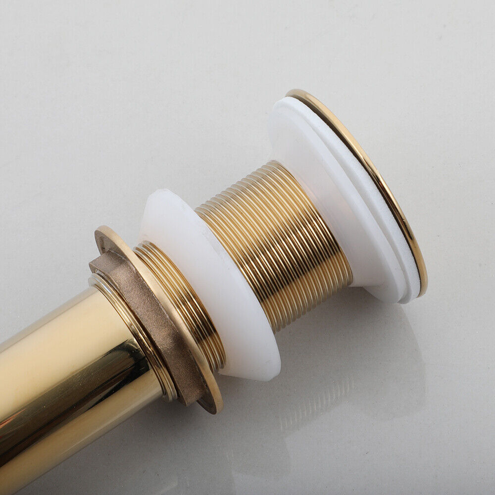 Gold-colored washbasin drain not closable