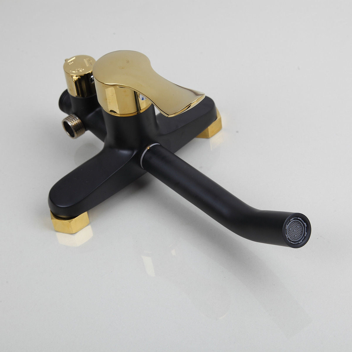 Matt black and gold surface-mounted shower