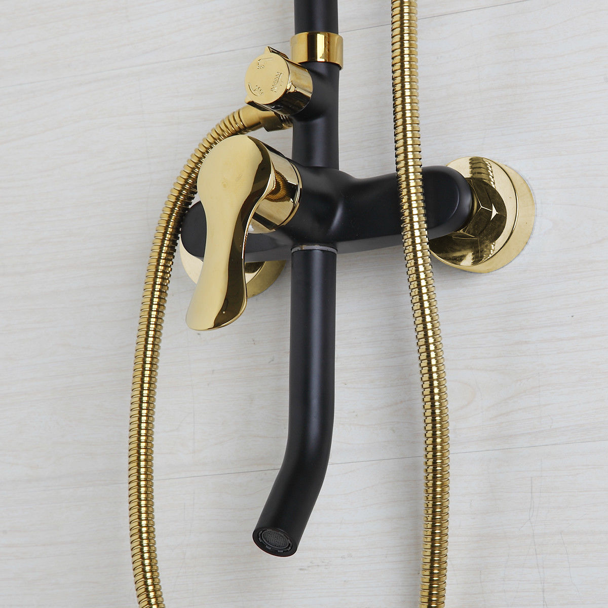 Matt black and gold surface-mounted shower