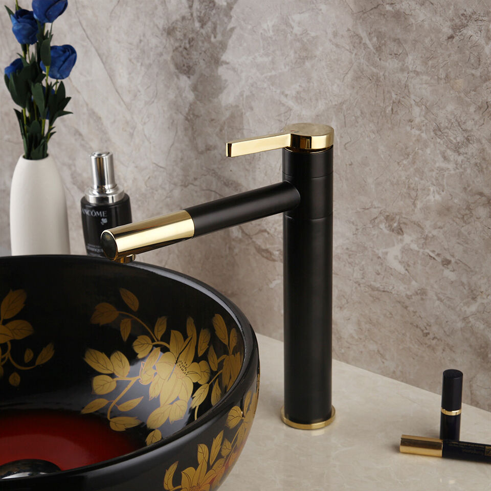 Black washbasin mixer tap with gold-colored elements