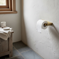 bronze-colored toilet roll holder
