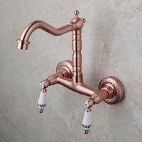 Koperkleurige landelijke muurkraan met hoge uitloop en keramische grepen