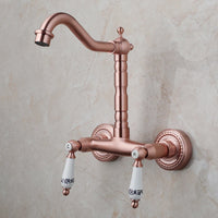 Koperkleurige landelijke muurkraan met hoge uitloop en keramische grepen