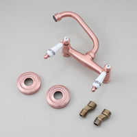 Koperkleurige landelijke muurkraan met keramische handgrepen