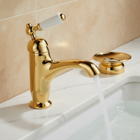 Goudkleurige nostalgische wastafelkraan met keramische hendel