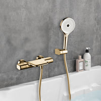 Gouden thermostatische badkraan met handdouche