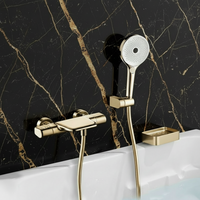 Gouden thermostatische badkraan met handdouche