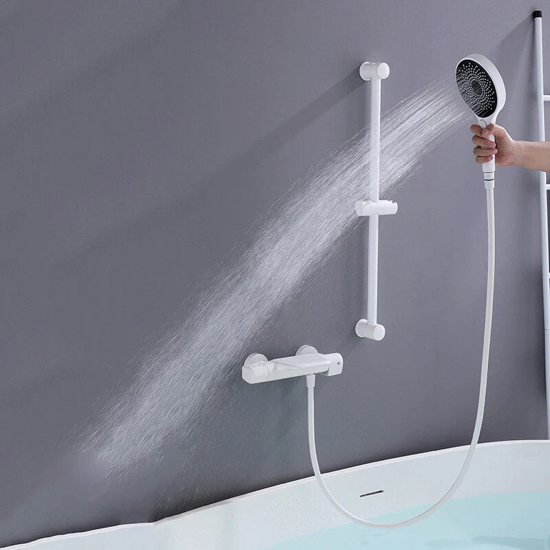 Witte thermostatische badkraan met handdouche en glijstang