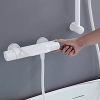 Witte thermostatische badkraan met handdouche en glijstang