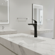 Modern, sleek black washbasin tap with an elegant spout