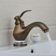 Retro bronze washbasin tap with an antique brass look